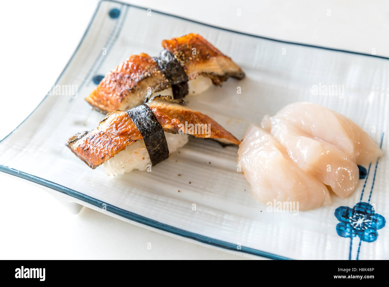 Unagi Sushi and fresh scallop hotate sashimi Stock Photo Alamy