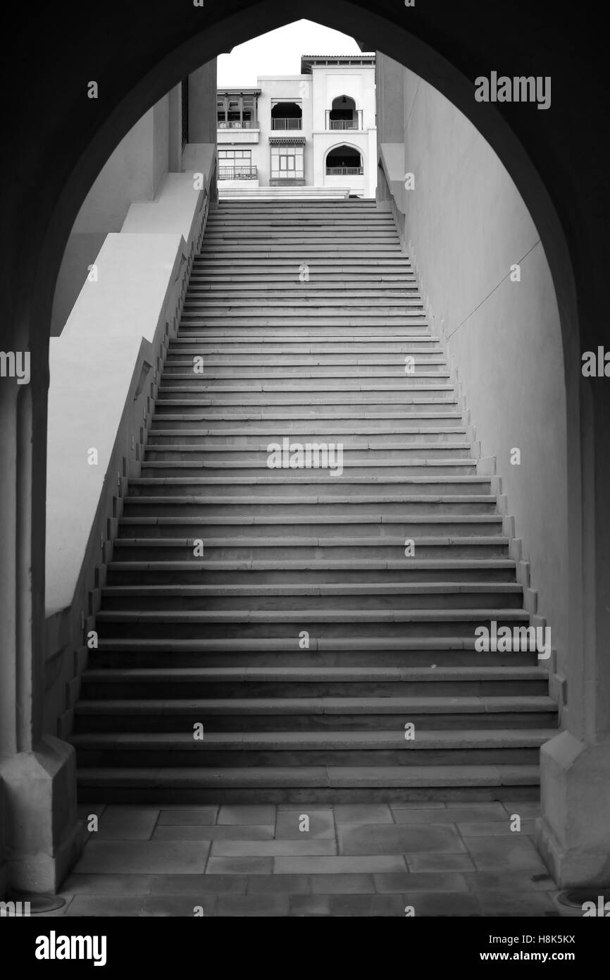 Black and white image of arch and stairs in Dubai souk Stock Photo