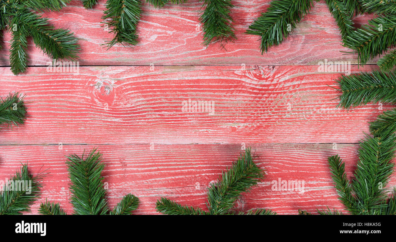 Rustic red wooden background with a complete fir branch border Stock ...