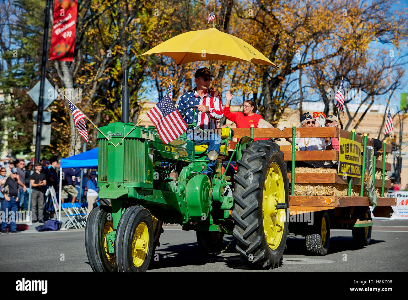 Prescott, AZ, USA - November 10, 2016: Vintage John Deere farm tractor and hay wagon at the Veterans Day Parade in Prescott, Arizona, USA. Stock Photo