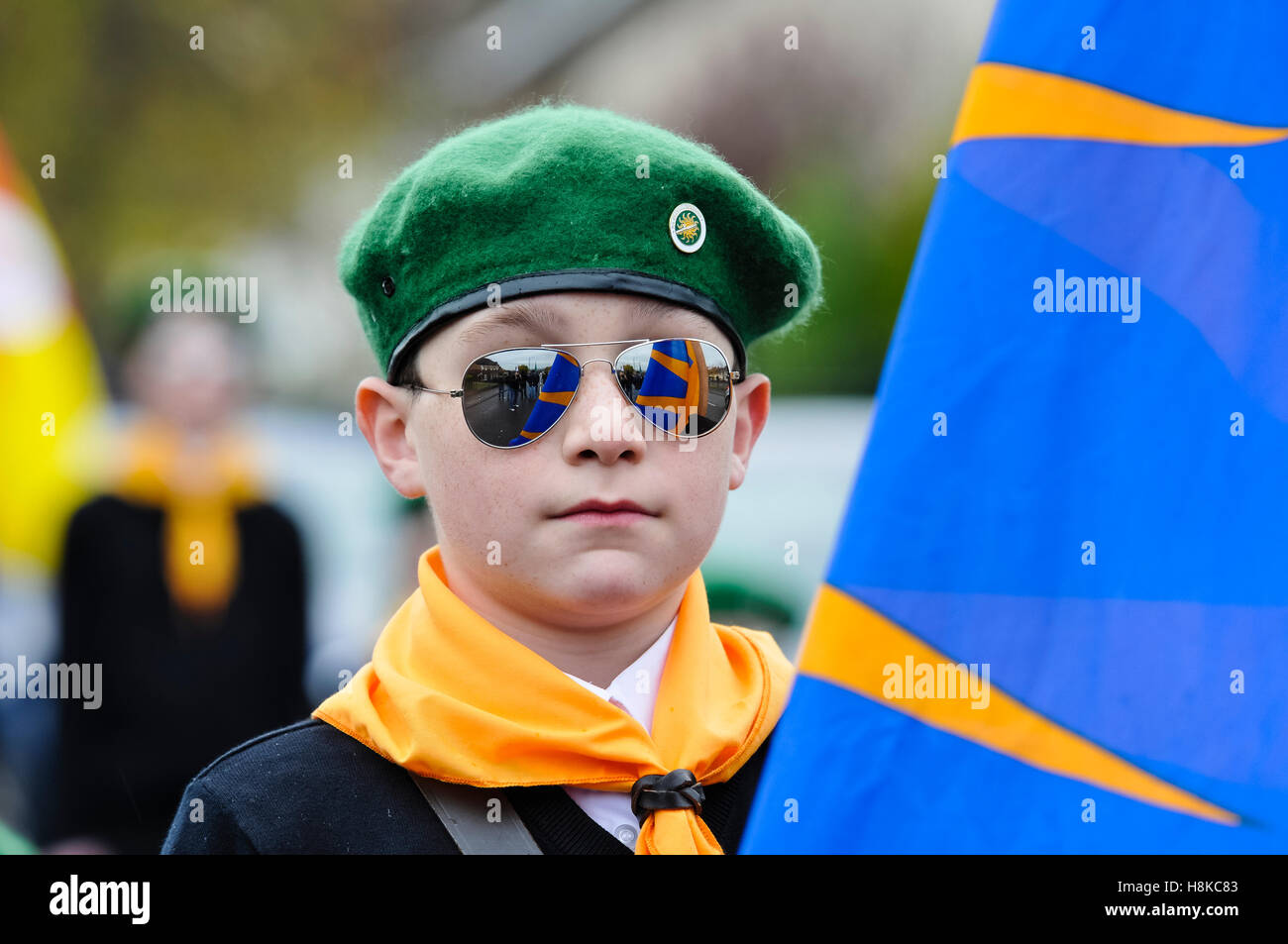 Belfast, Northern, Ireland. 13th Nov, 2016. A young boy wearing a green beret, and mirrored sunglasses, carries a flag at the head of a Republican parade in remembrance of Vol. Patricia Black, who died 15 Nov 1991. Credit:  Stephen Barnes/Alamy Live News Stock Photo