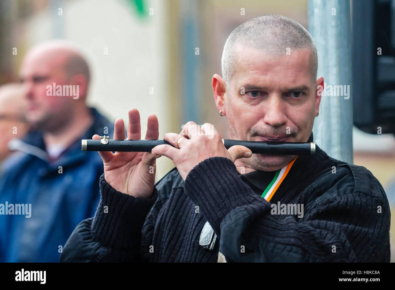Belfast, Northern, Ireland. 13th Nov, 2016. A man plays a lament on a flute as Republicans hold a parade in remembrance of Vol. Patricia Black, who died 15 Nov 1991. Credit:  Stephen Barnes/Alamy Live News Stock Photo