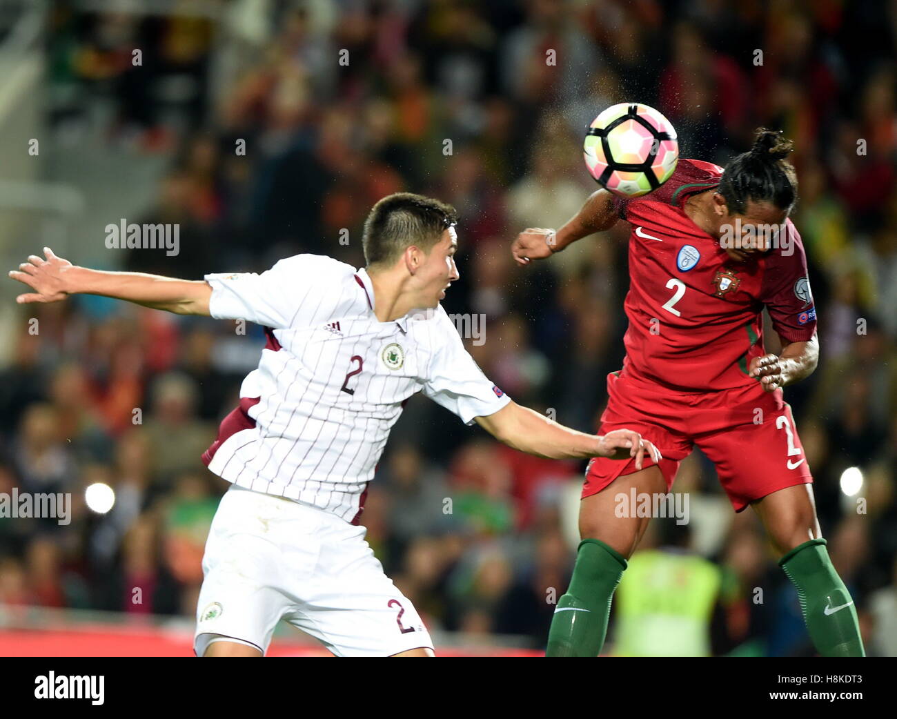 Faro, Portugal. 13th Nov, 2016. Portugal's Bruno Alves (R) vies with Latvia's Vitalijs Maksimenko during the FIFA World Cup 2018 qualifier Group B match between Portugal and Latvia at the Algarve stadium in Faro, Portugal, on Nov. 13, 2016. Portugal won 4-1. Credit:  Zhang Liyun/Xinhua/Alamy Live News Stock Photo