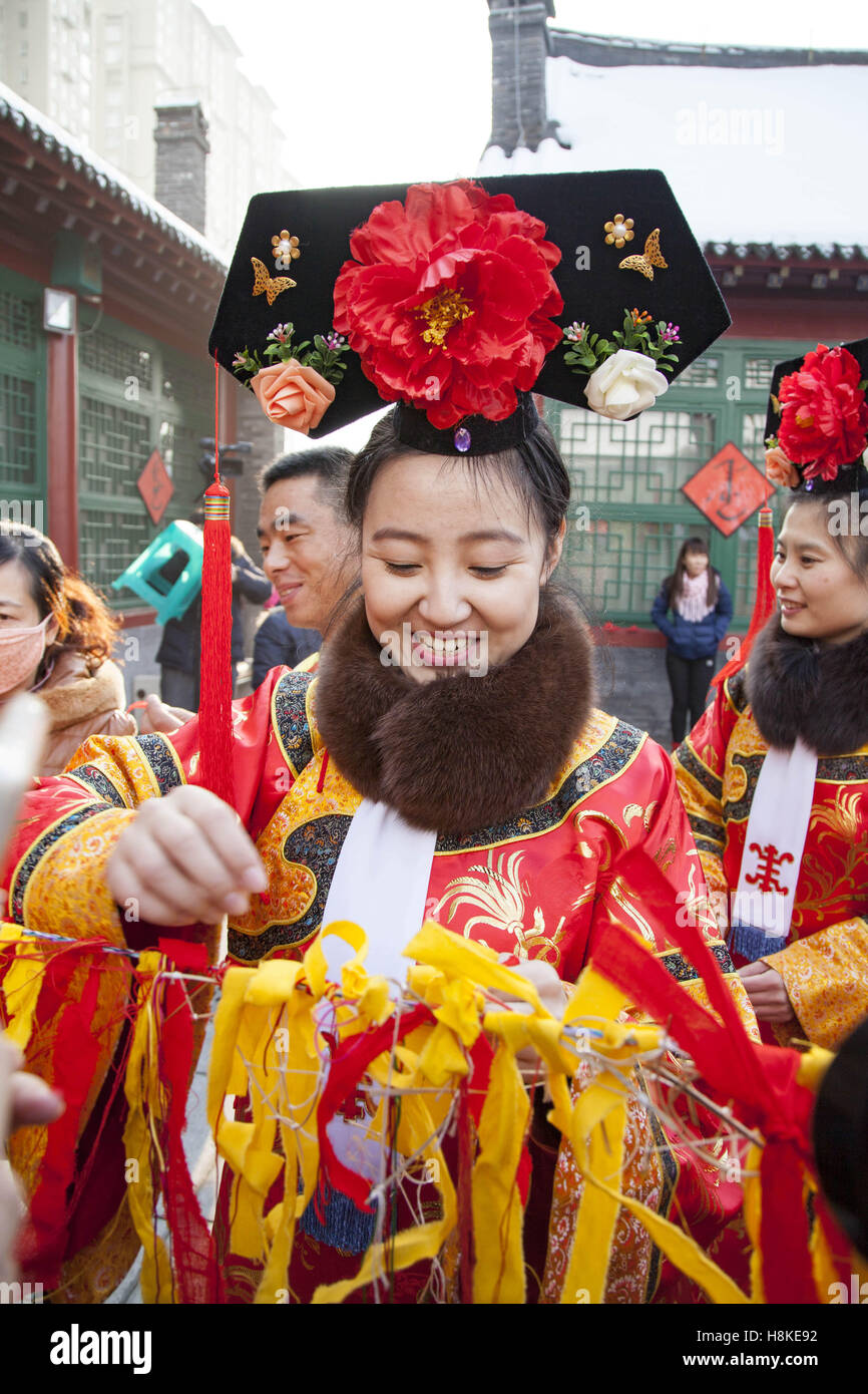 Jilin, Jilin, China. 12th Nov, 2016. Jilin, CHINA-November 12 2016: (EDITORIAL USE ONLY. CHINA OUT) .A woman wearing traditional clothes of Man ethnic minority group. People celebrate the traditional 'Banjin' Festival of Man ethnic minority group at Manchu Museum in Jilin, northeast China's Jilin Province, November 12th, 2016. Man ethnic minority group usually celebrate the 'Banjin' Festival on the 13th day of the 10th month of the Chinese lunar calendar every year. During the festival, the Manchu Museum launched activities of enjoying Man traditional clothes, experiencing intangible cult Stock Photo