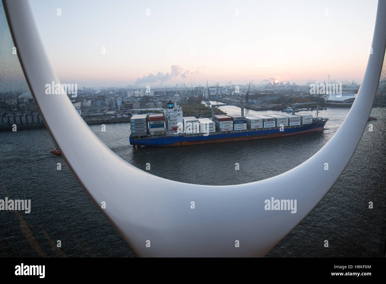 Hamburg, Germany. 13th Nov, 2016. The container ship "Maersk Nimes" drives by headed north within the port in Hamburg, Germany, 13 November 2016. Photographed from a balcony of the Elbphilharmonie. Photo: Christian Charisius/dpa/Alamy Live News Stock Photo