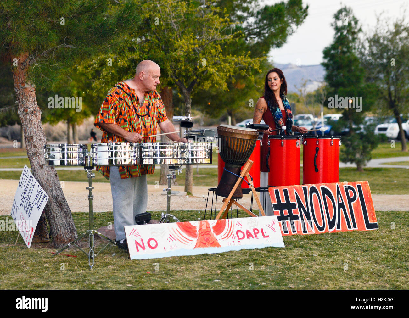 Las Vegas, USA. 13th Nov, 2016. November 13, 2016, Sunset Park Las Vegas Nevada, A drum circle forms at sunset in support of 'Standing Rock' defending the Native American tribal lands from the construction of the 'Dakota Access Pipe Line'. #NODAPL Credit:  Ken Howard/Alamy Live News Stock Photo