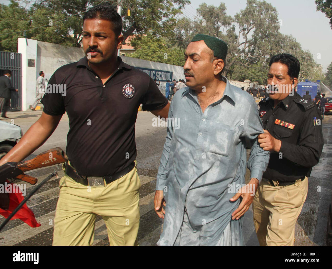 Police arresting protesters belonging to Irrigation Department of Sindh and were trying to get enter into Red Zone area, nearby Karachi press club on Monday, November 14, 2016. Stock Photo