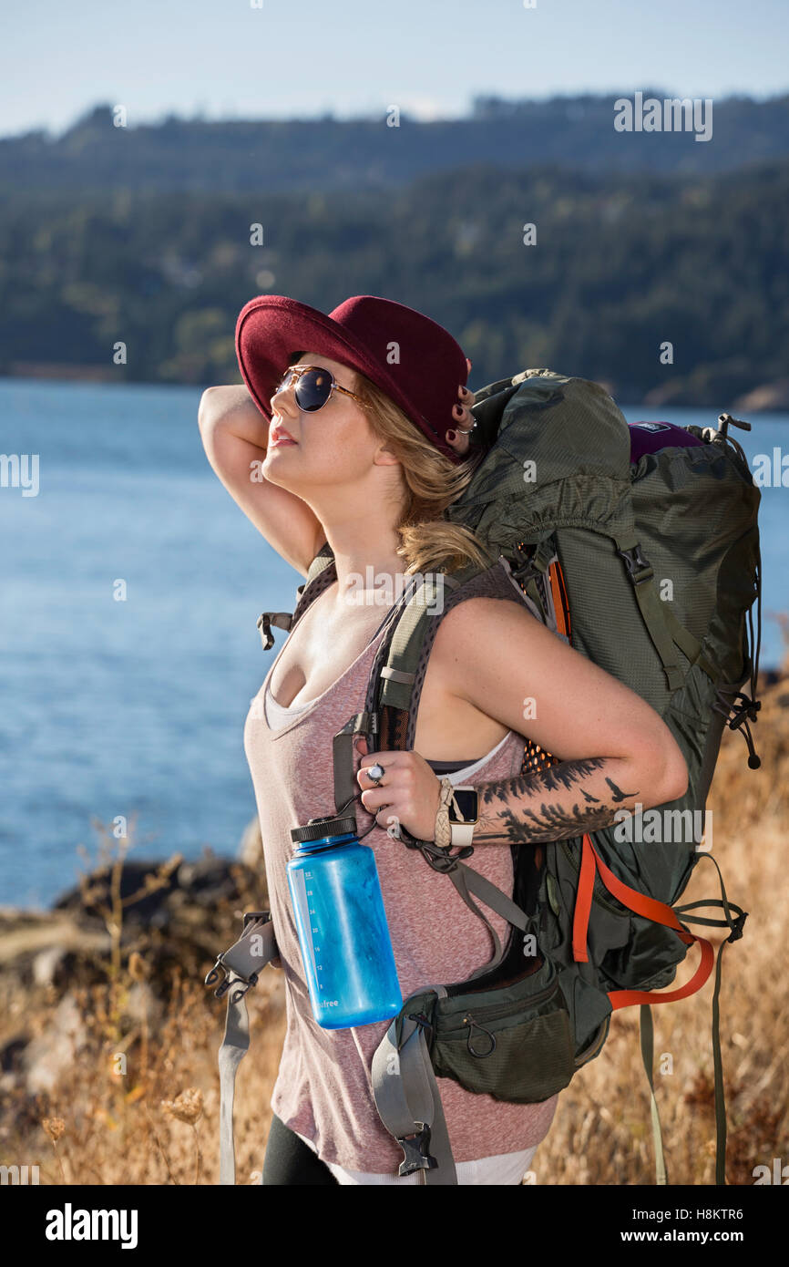 Beautiful woman backpacking in wilderness Stock Photo - Alamy