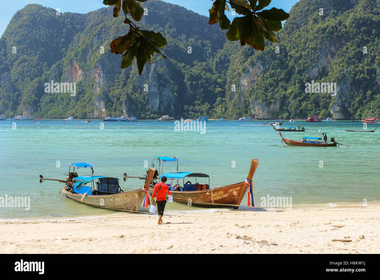 KRABI, PHI-PHI, THAILAND - NOVEMBER 29, 2013: Longtrail boat on Loh samah bay at phi phi island. Stock Photo