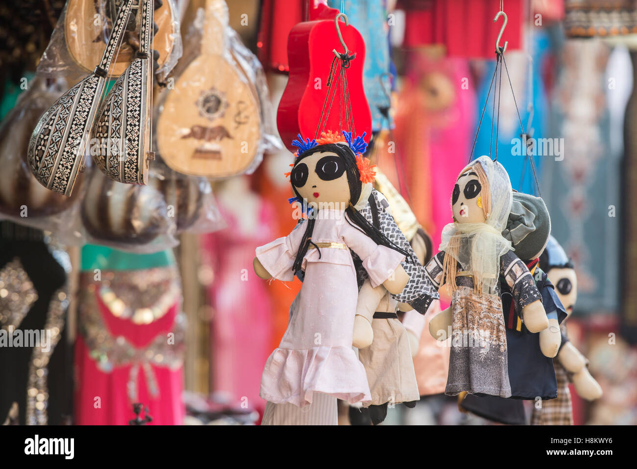 Cairo, Egypt. Close up of handmade dolls, musical instruments (5 stringed oud) and other souvenirs for sale in a shop in the out Stock Photo