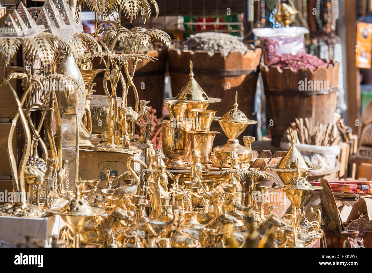 Cairo, Egypt. Close up of gold statues and replicas of buildings for sale in the outdoor bazaar/ flea market Khan el-Khalili in Stock Photo
