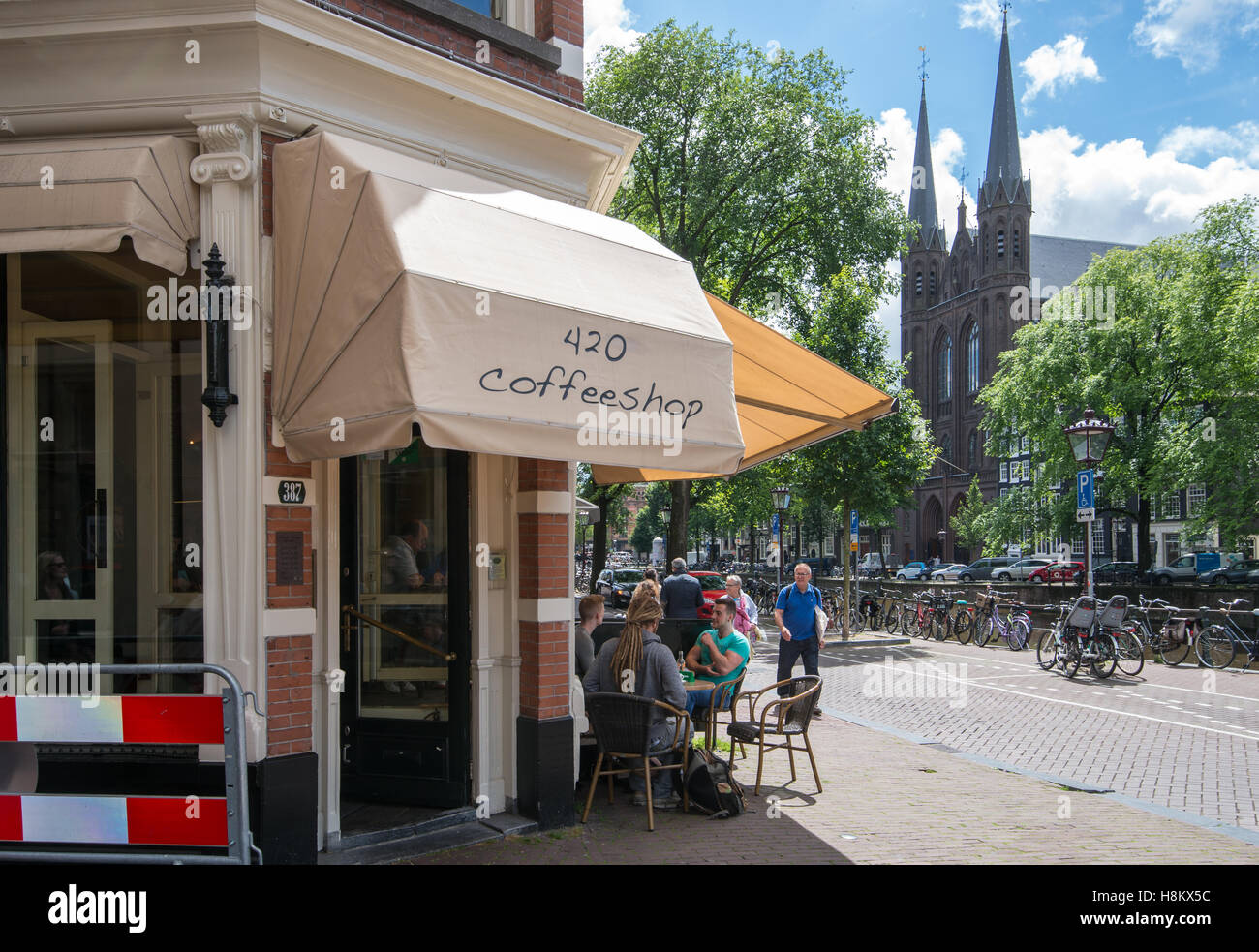Amsterdam, Netherlands local coffee shop with people lounging outside. Stock Photo