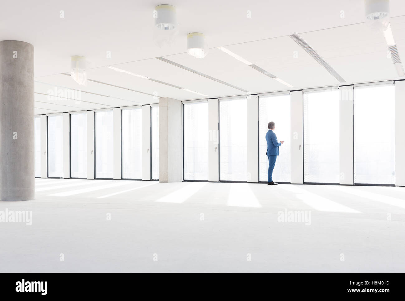 Mature businessman visiting empty office space Stock Photo Alamy