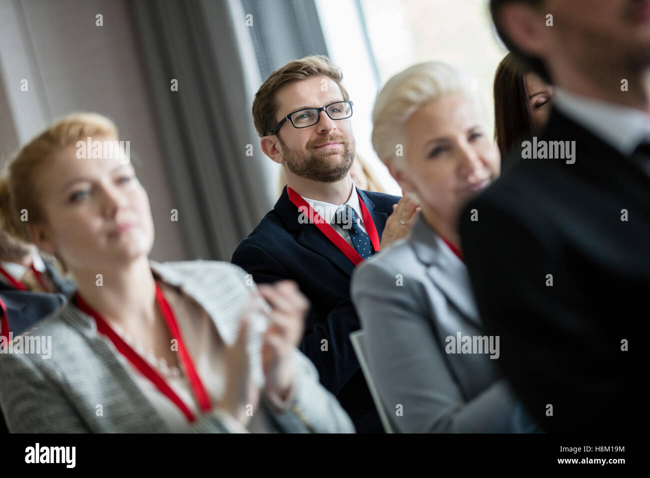 Business people applauding during seminar Stock Photo