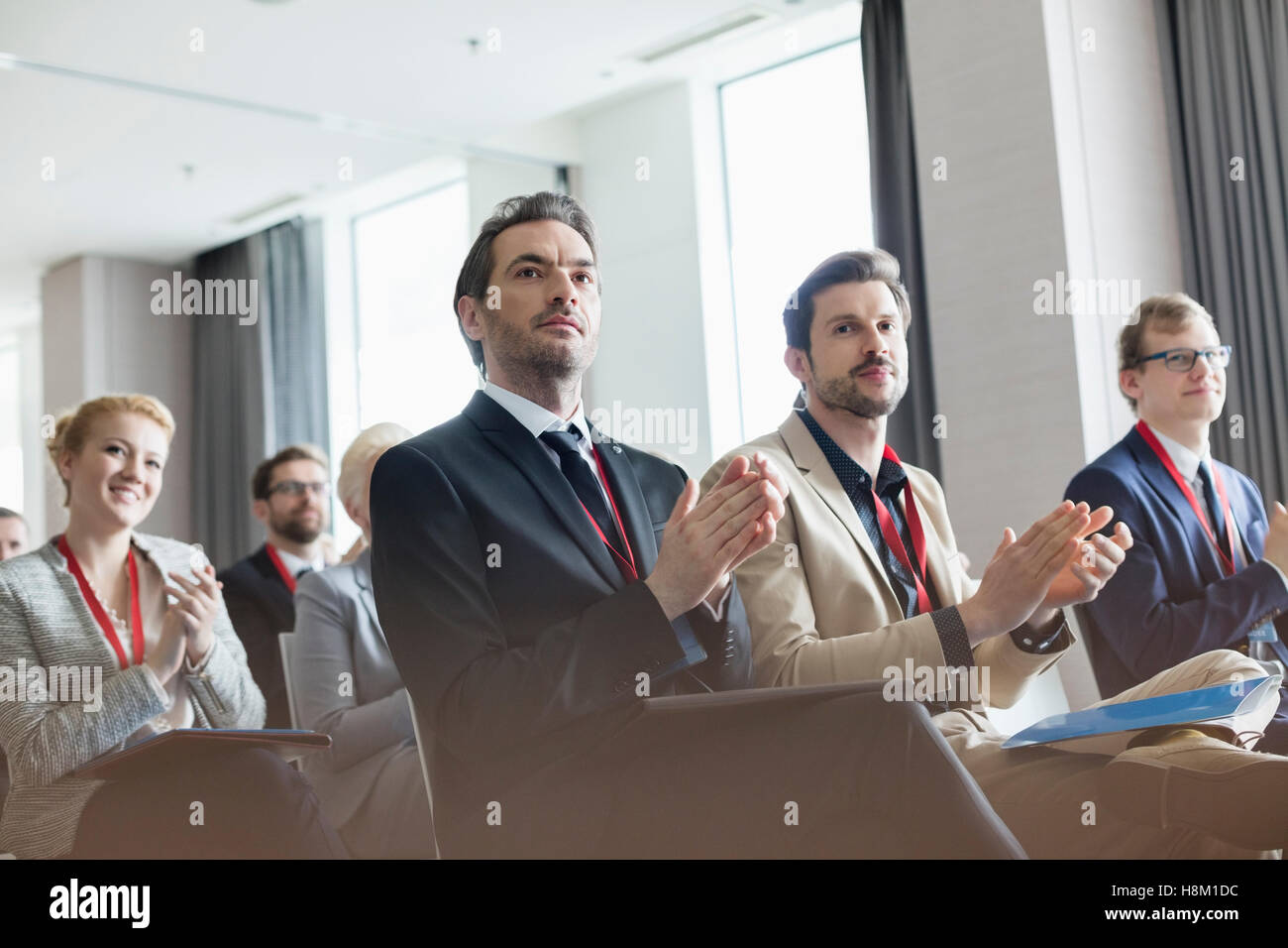 Business people applauding during seminar Stock Photo