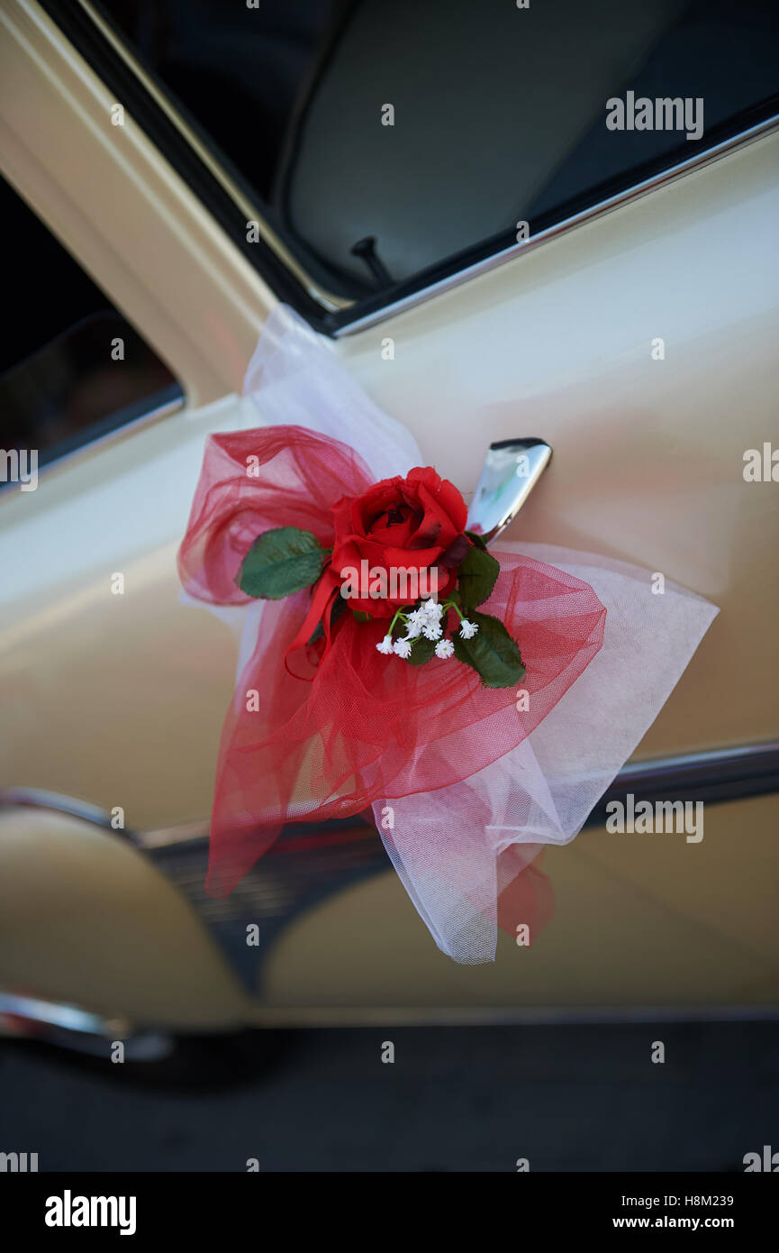wedding car decorated with a rose flower Stock Photo