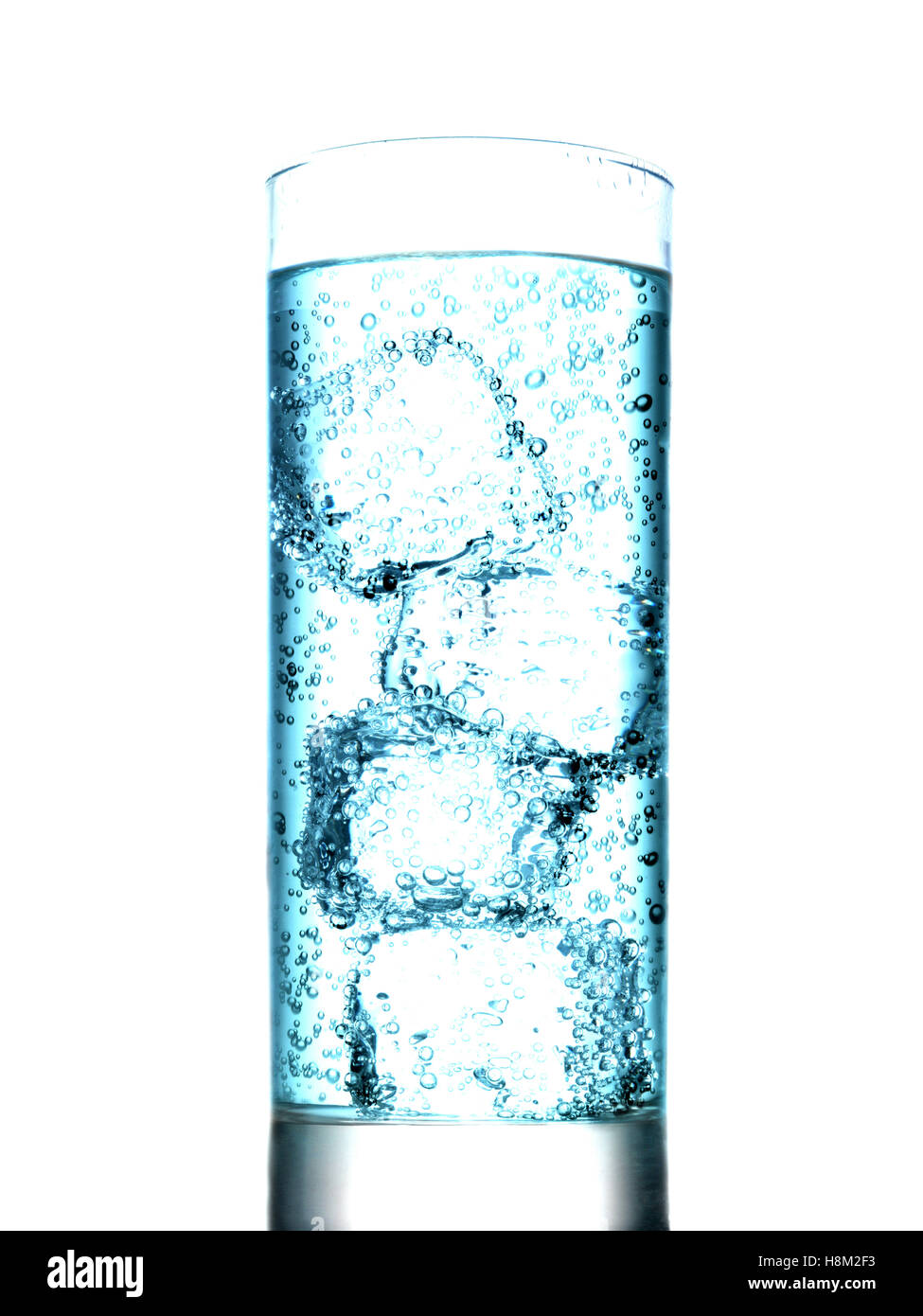 Glass of water with ice cubes on white background Stock Photo