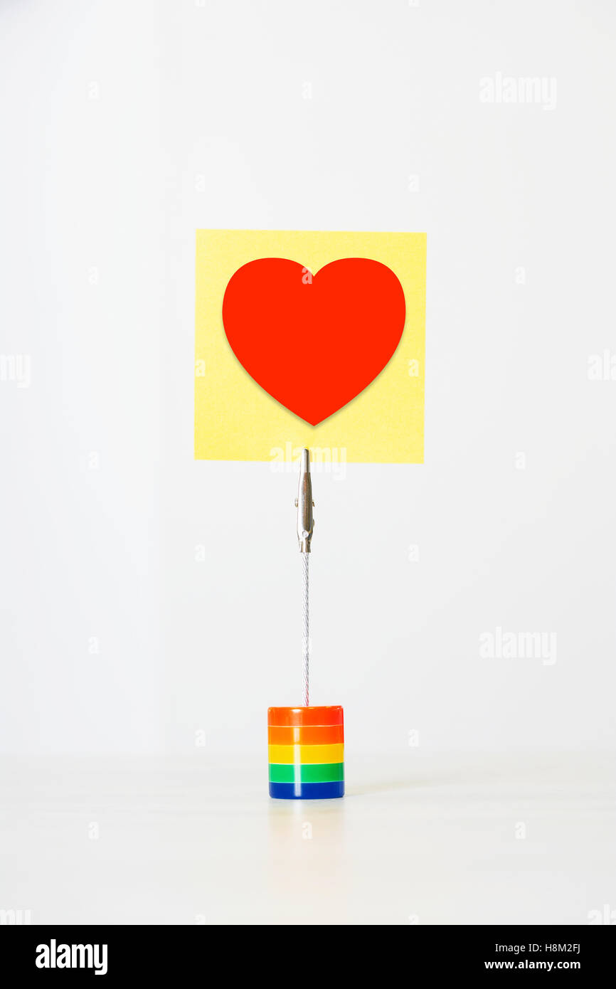 Closeup of a blank sticky notepaper with red heart Stock Photo