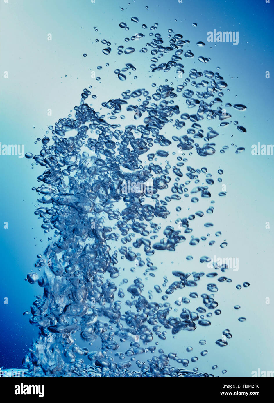 Air Bubbling Upward Through Water Stock Photo