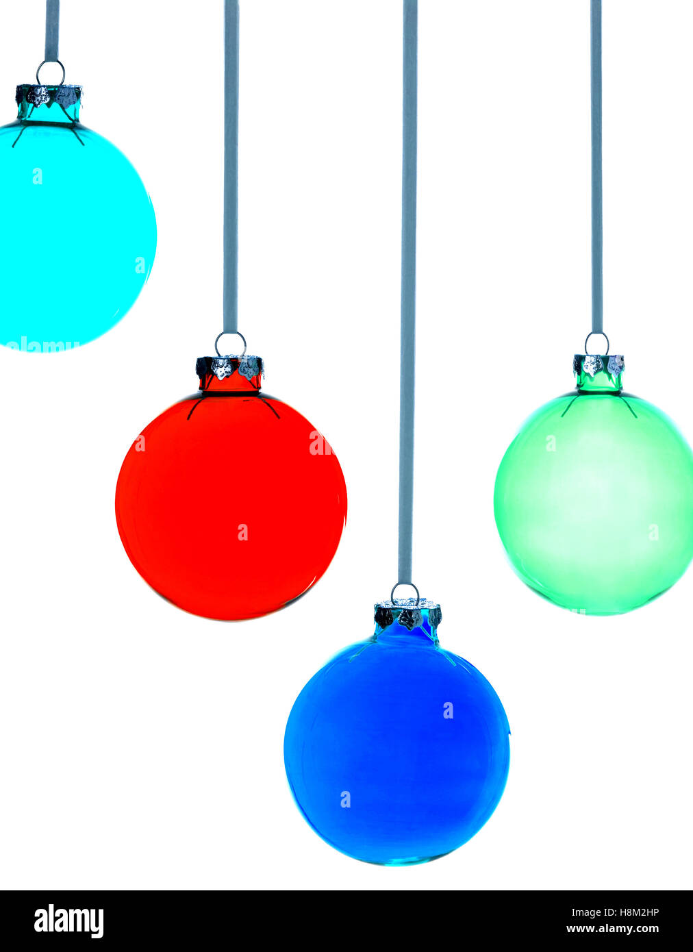 Four Christmas baubles on white background Stock Photo - Alamy