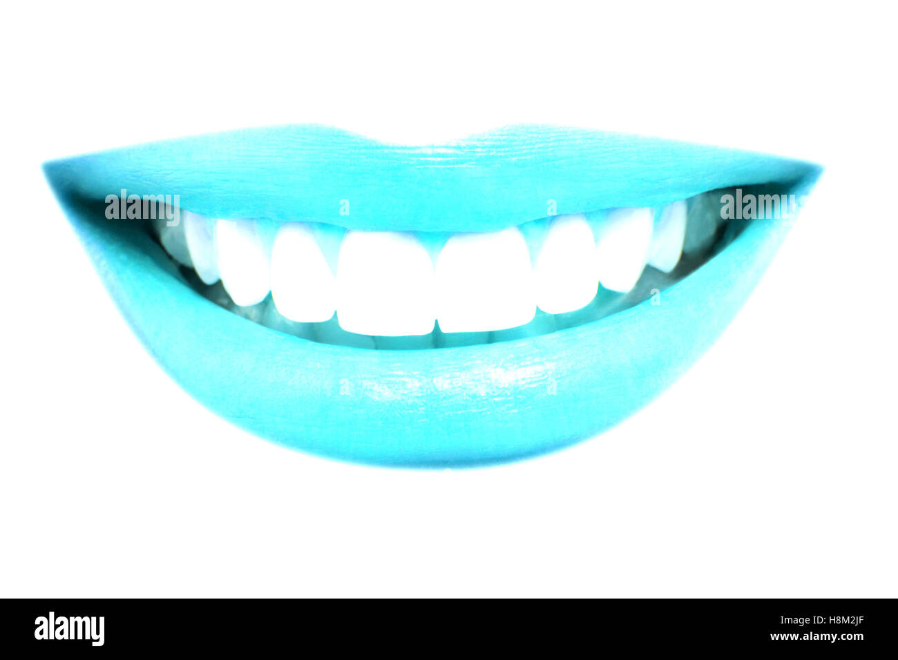 Closeup of beautiful blue lips smile with healthy teeth on white