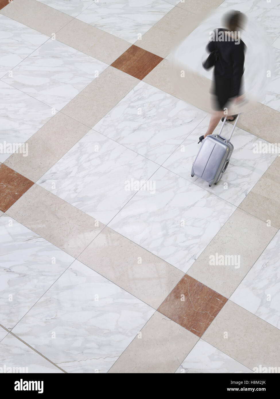 Business Woman walking in a blurred motion Stock Photo