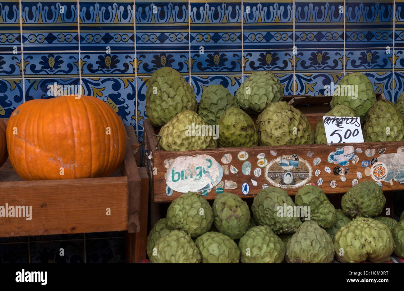 Cherimoya (right), or custard apple, with a pumpkin at the Workers' Market, Mercado dos Lavradores, Funchal, Madeira, Portugal Stock Photo