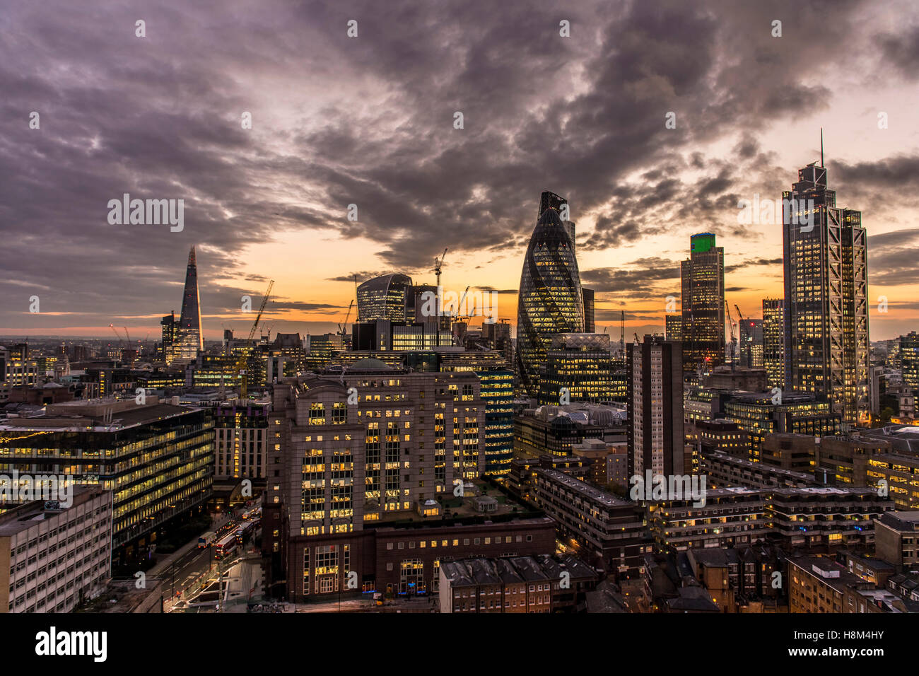 a London skyline, cityscape, high rise, skyscraper, the Gherkin, Tower 42, Heron Tower, night, dusk city, financial center Stock Photo