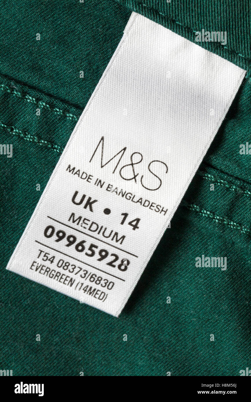 label in M&S green trousers made in Bangladesh - sold in the UK United Kingdom, Great Britain Stock Photo