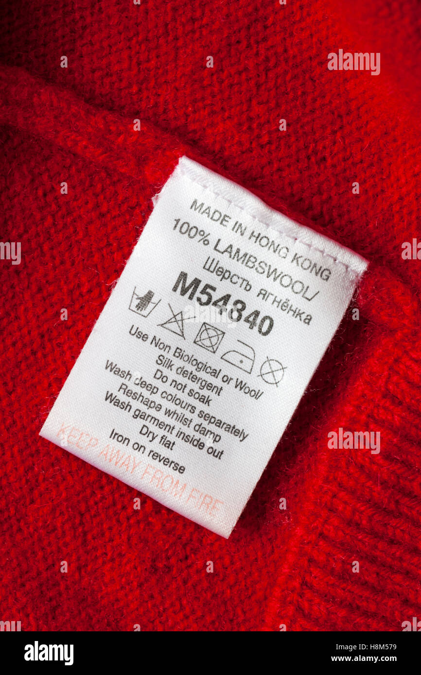 care instructions label in 100% lambswool jacket made in Hong Kong - sold in the UK United Kingdom, Great Britain Stock Photo