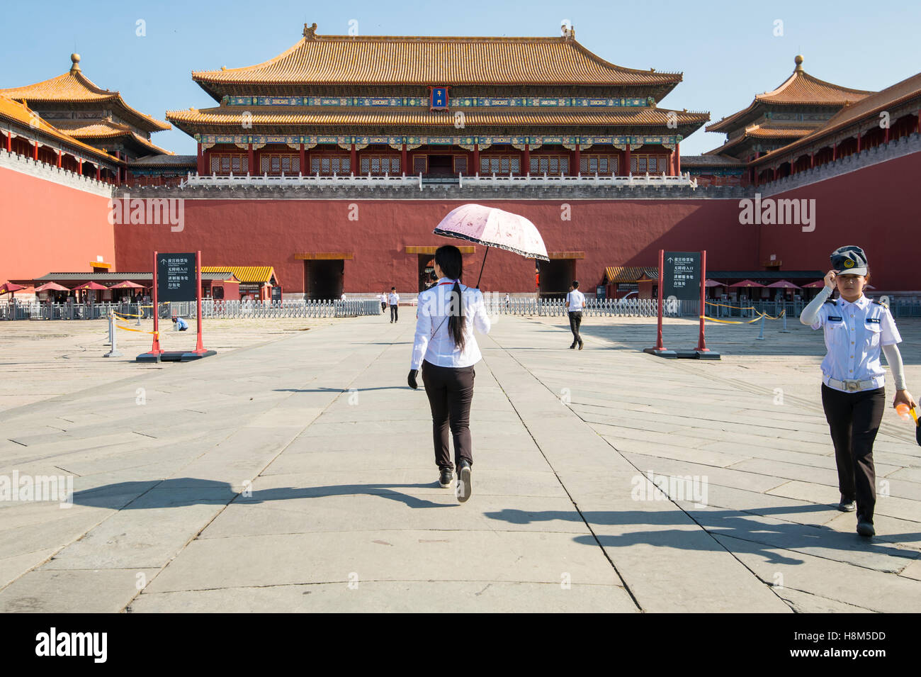Beijing China - Tourists walking and taking pictures outside of the Meridian Gate (WuMen) that surrounds the Forbidden City. Cha Stock Photo