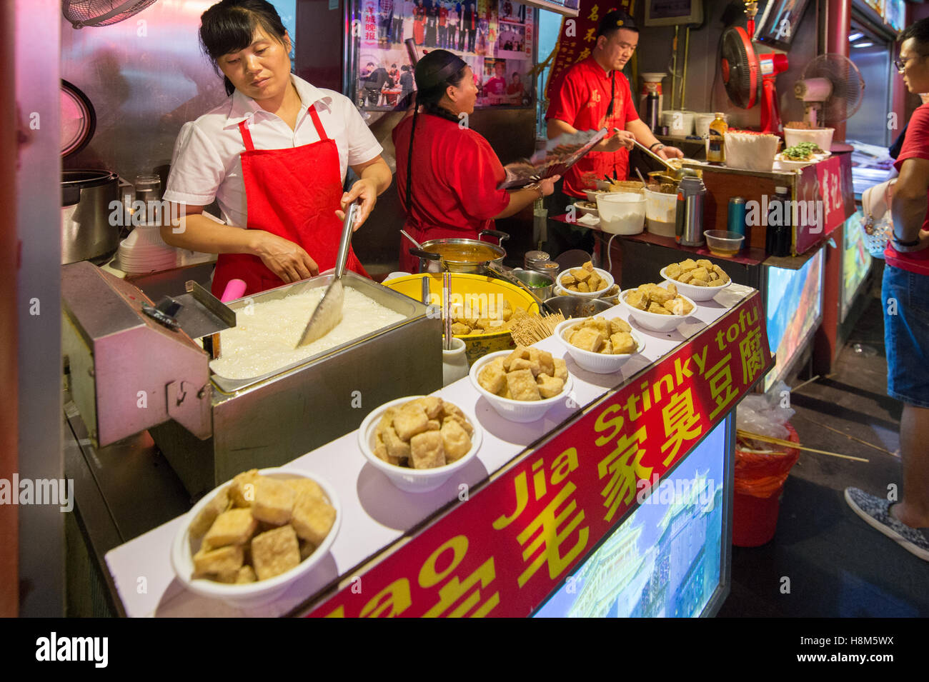 Beijing, China - The Donghuamen Snack Night Market, a large outdoor market that is an attraction for locals and tourists, locate Stock Photo
