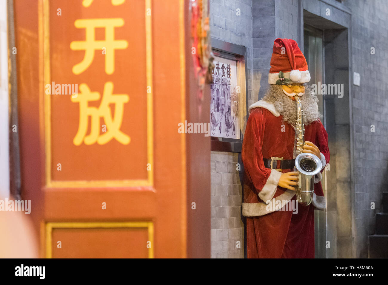 Beijing, China A statue of Santa Claus playing the saxophone in the