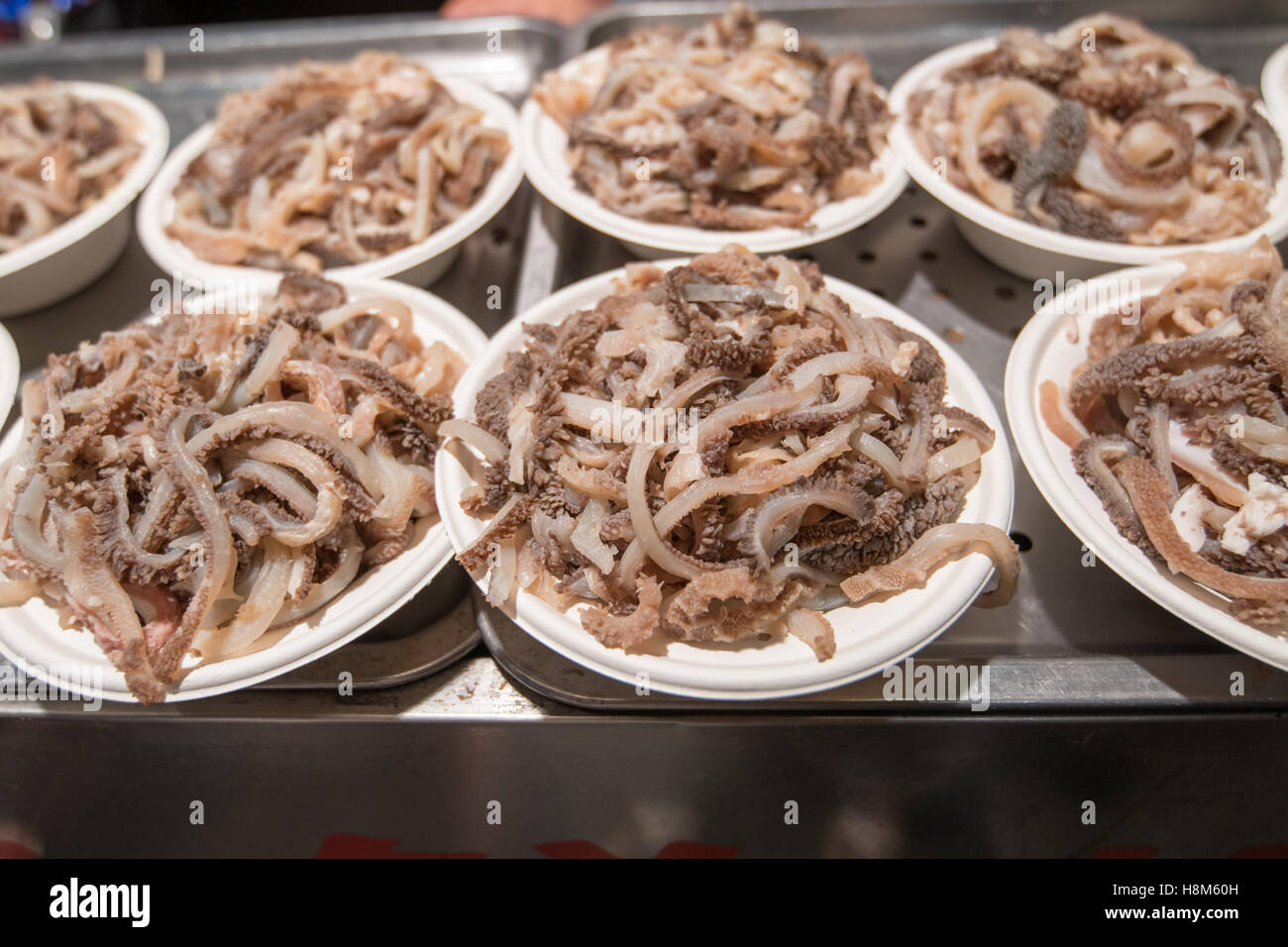 Beijing, China - Plates of octopus for sale at the Donghuamen Snack Night Market, a large outdoor market that is an attraction f Stock Photo