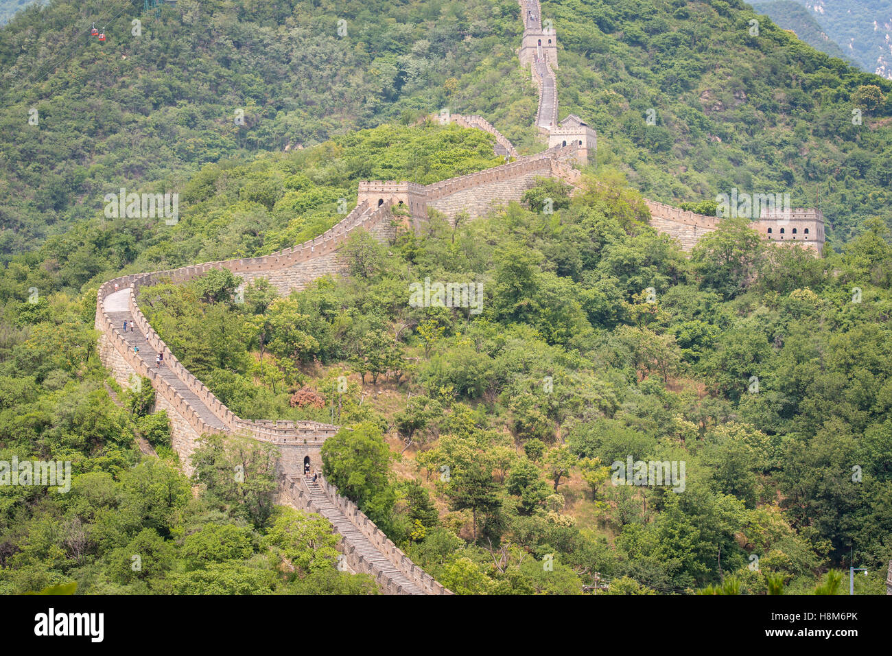Mutianyu, China - Landscape view of the Great Wall of China. The wall stretches over 6,000 mountainous kilometers east to west a Stock Photo