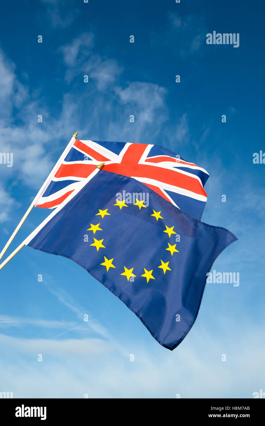 European Union and British Union Jack flag flying in front of bright blue sky in representation of the Brexit EU referendum Stock Photo