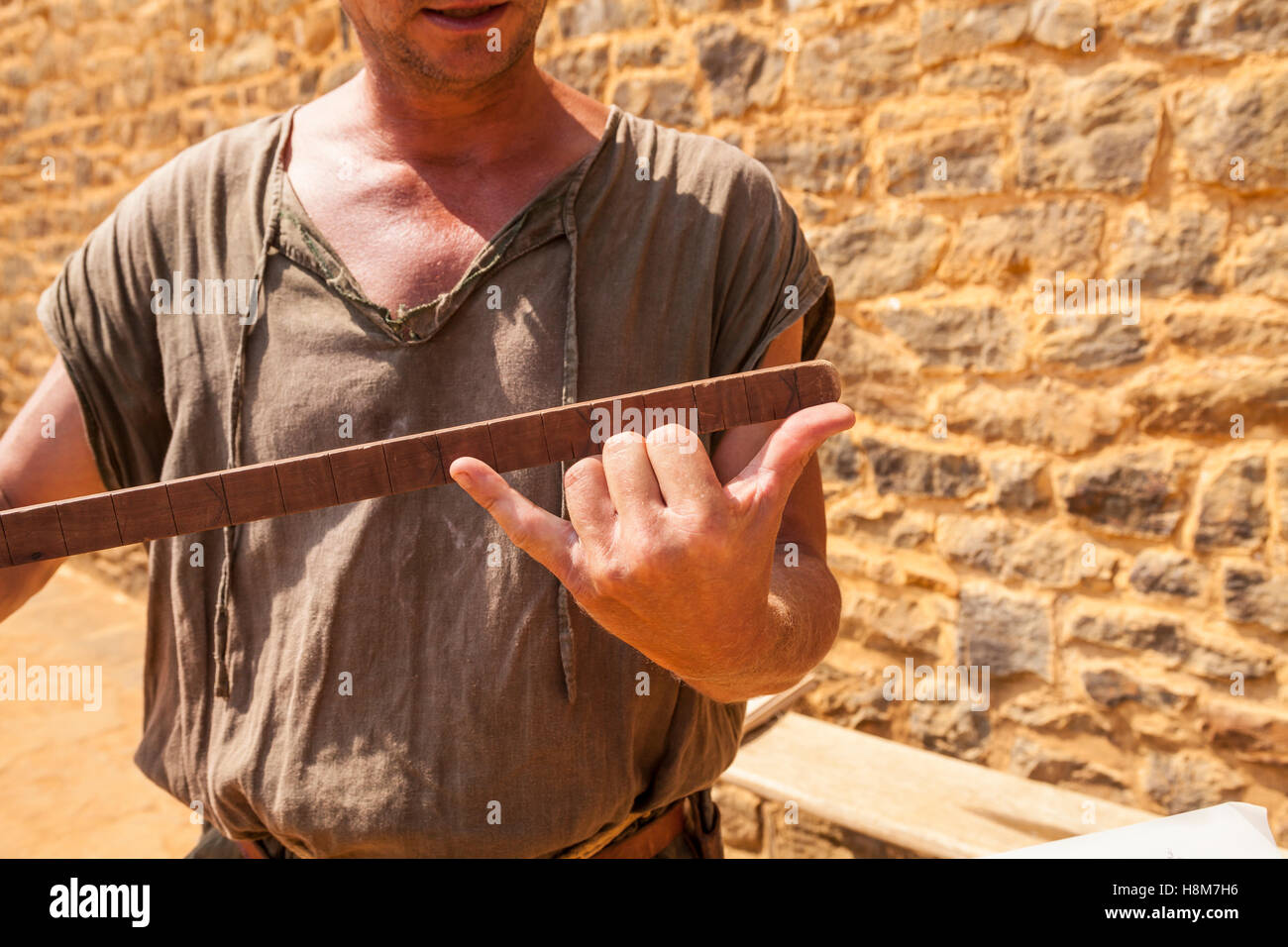 Our guide explaining how to use a medieval measuring stick Stock Photo