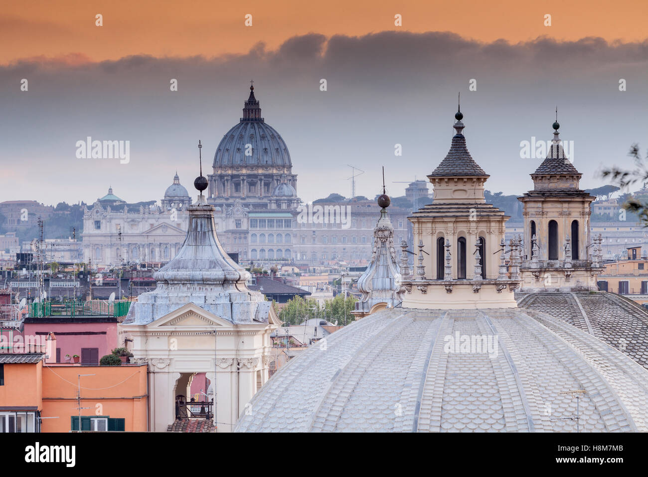 Looking over the rooftops of Rome to Saint Peter's basilica. Stock Photo