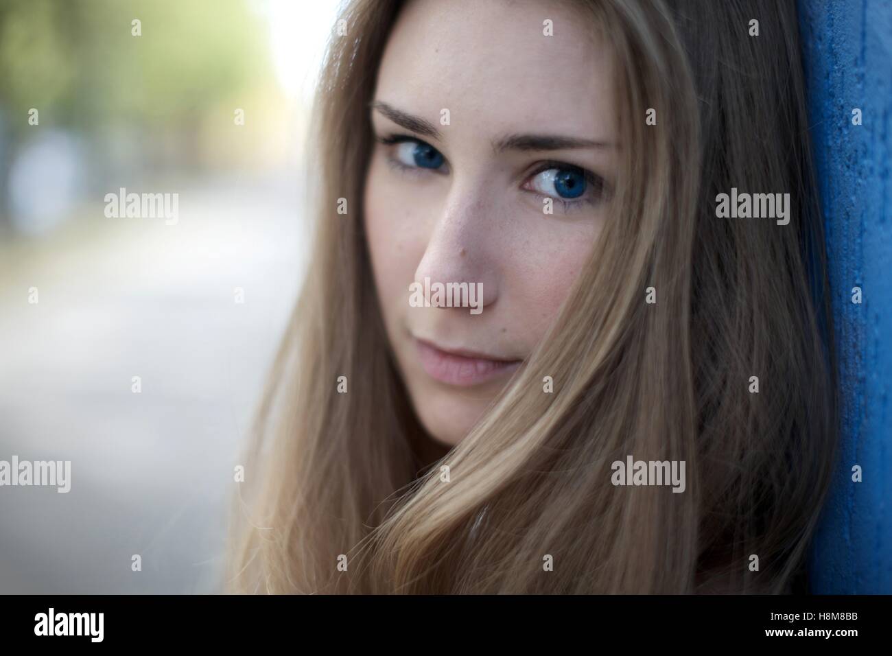 Closeup Blondie 23 year old in blue dress Stock Photo