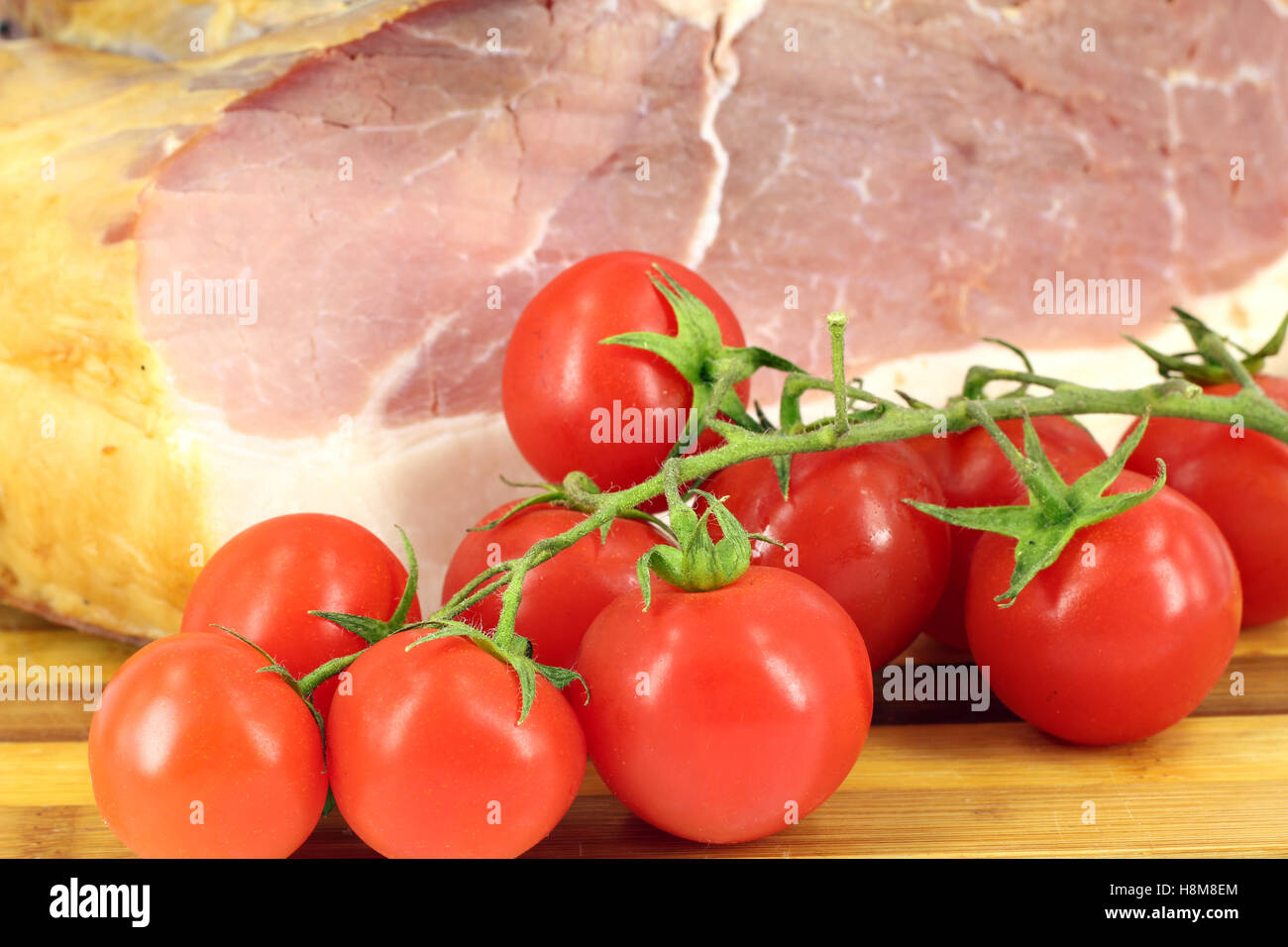 smoked ham and tomatoes close up Stock Photo