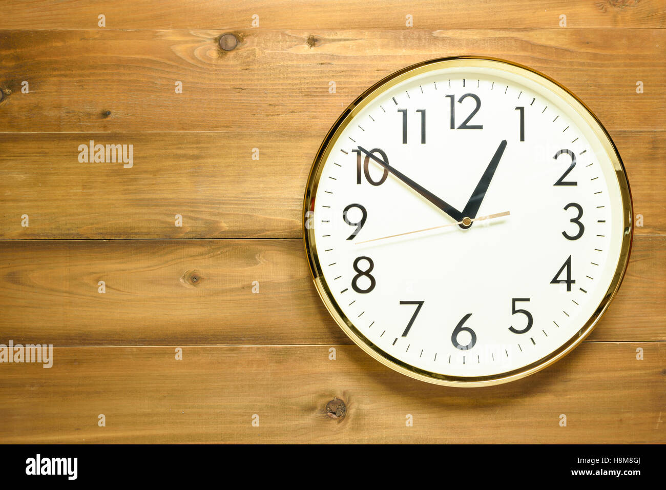 wall clock on the wooden wall early afternoon Stock Photo Alamy