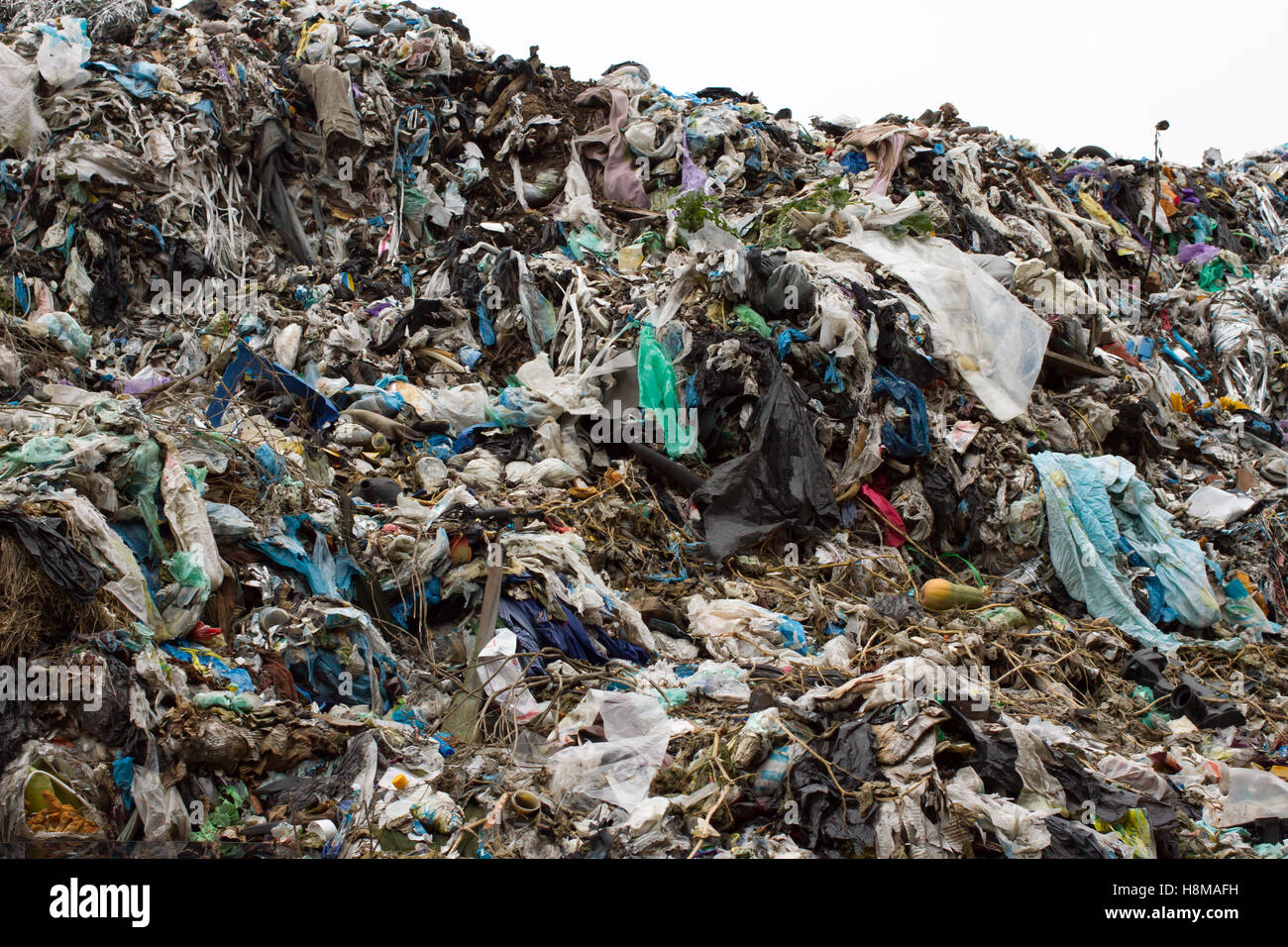 Pile of plastic bags and other refined petroleum products dumped in