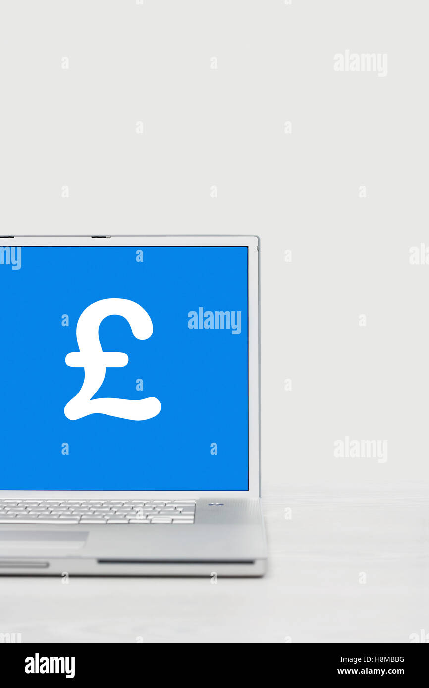 Laptop with pound symbol Stock Photo