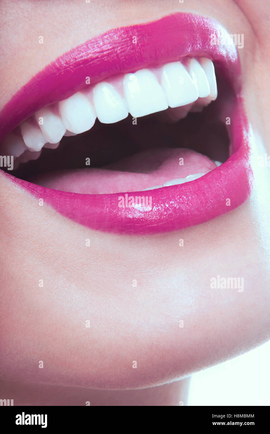 Closeup of laughing woman with pink lips Stock Photo