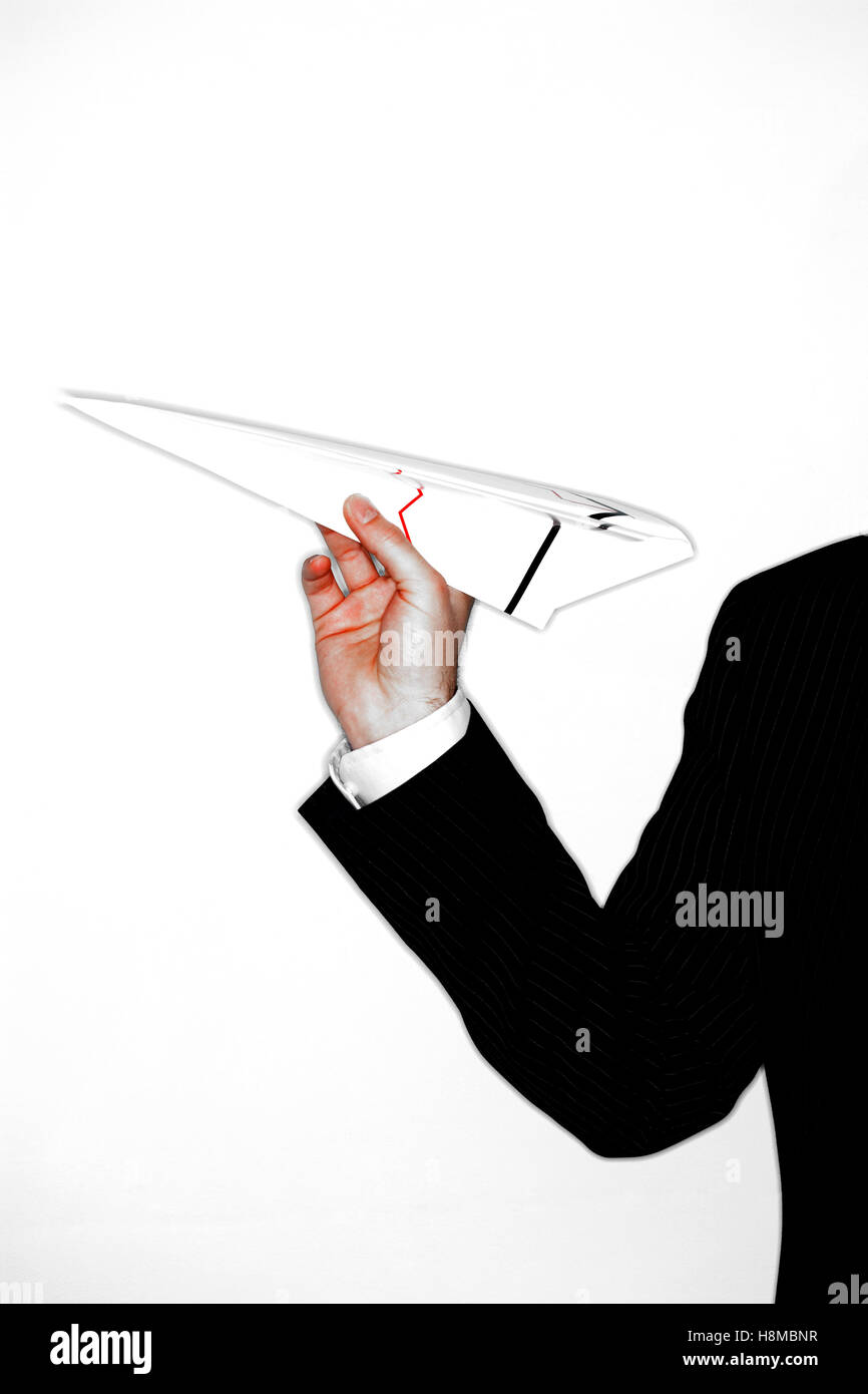 Businessman Throwing Paper Airplane Stock Photo