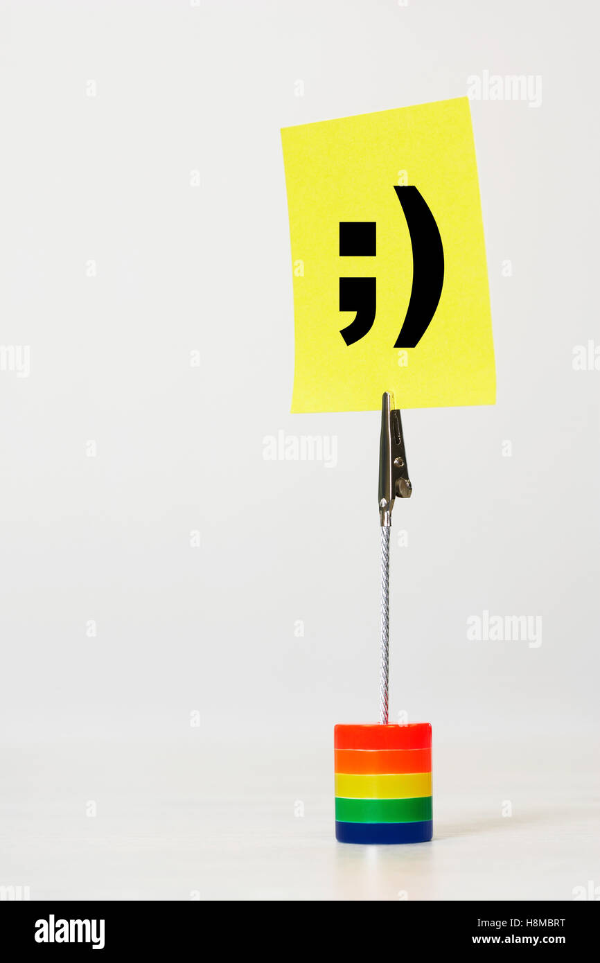 Wink Smiley face icon reminder note Stock Photo