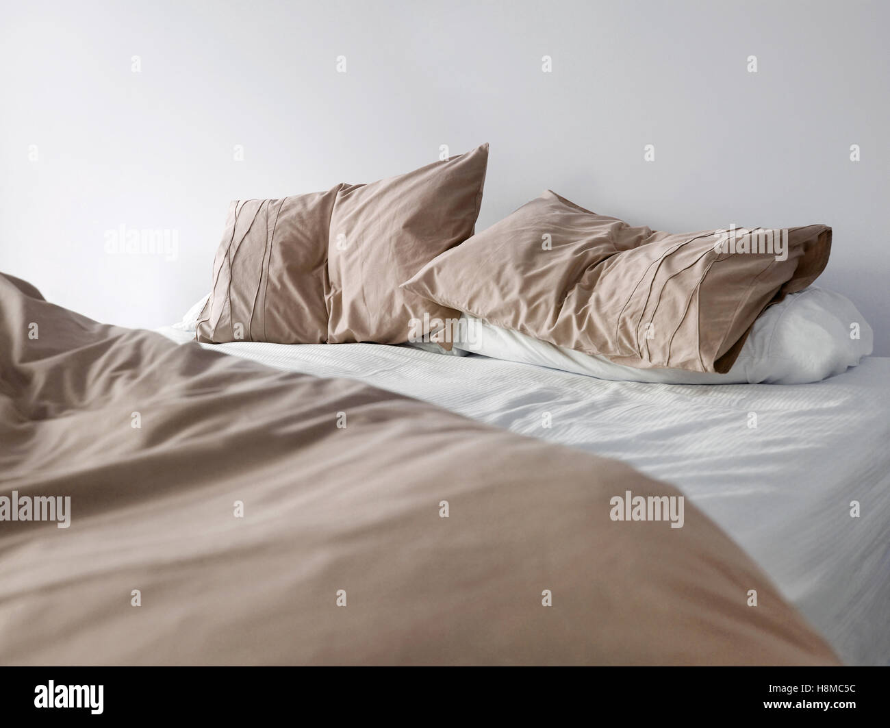 Brown bedding on bed Stock Photo Alamy