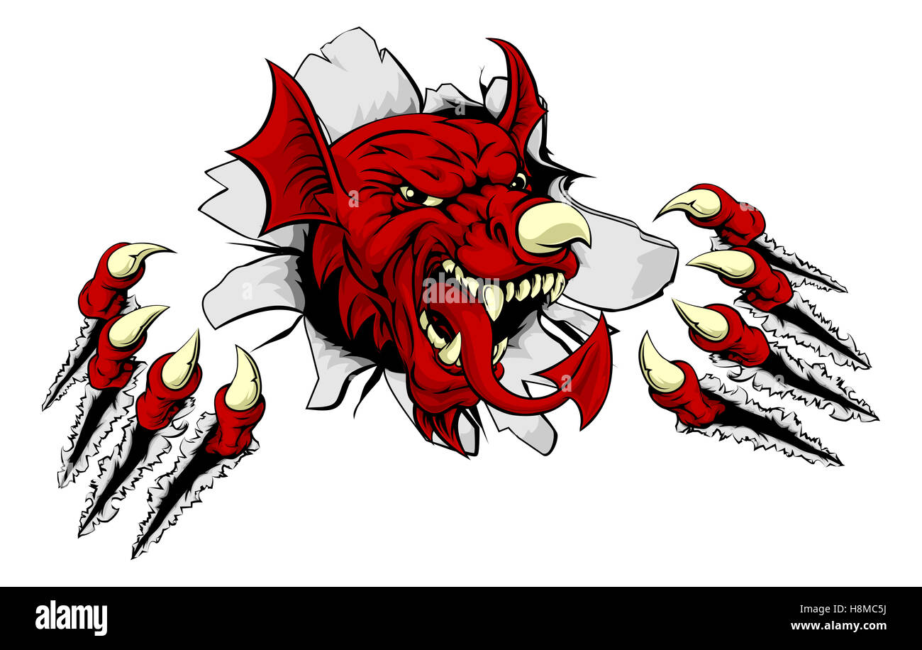 Welsh red dragon Y Ddraig Goch breaking through the background with his claws. Sports mascot. Stock Photo