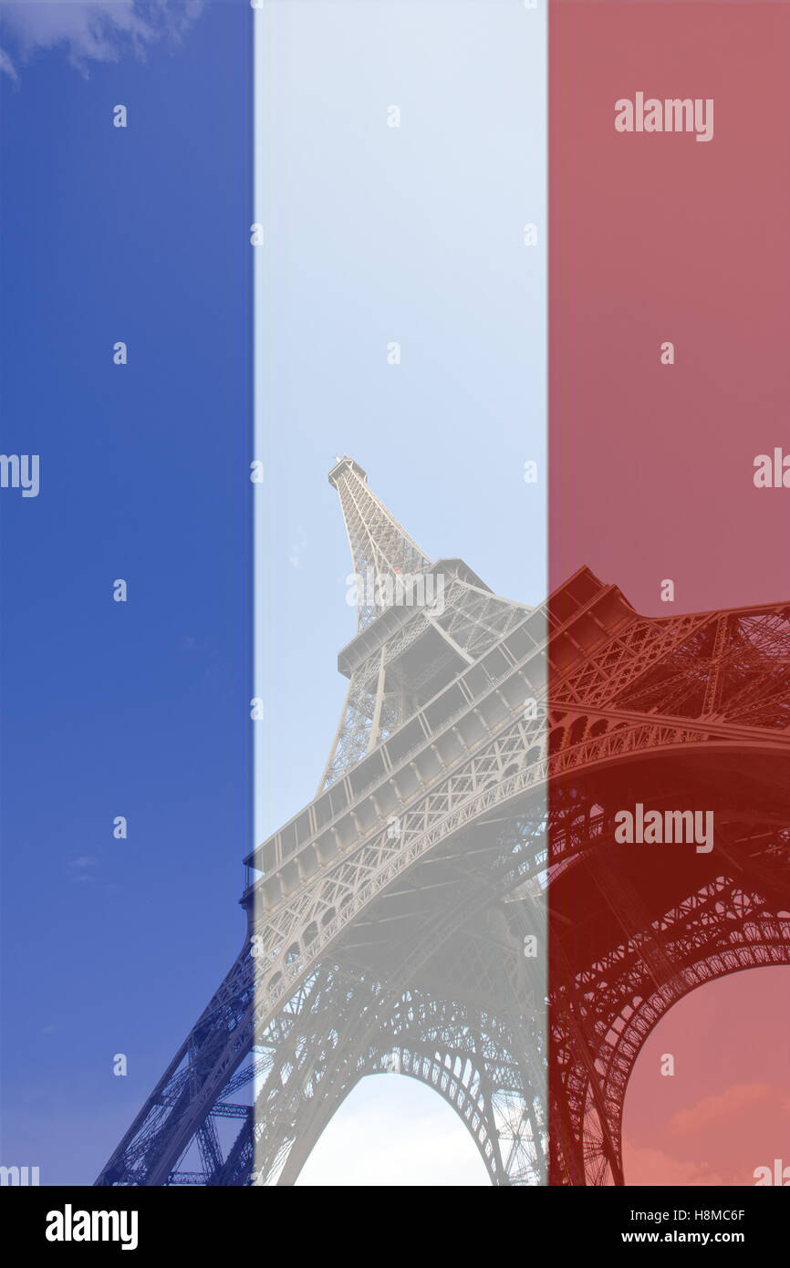 Low Angle view of Eiffel Tower in front of French flag background Stock Photo