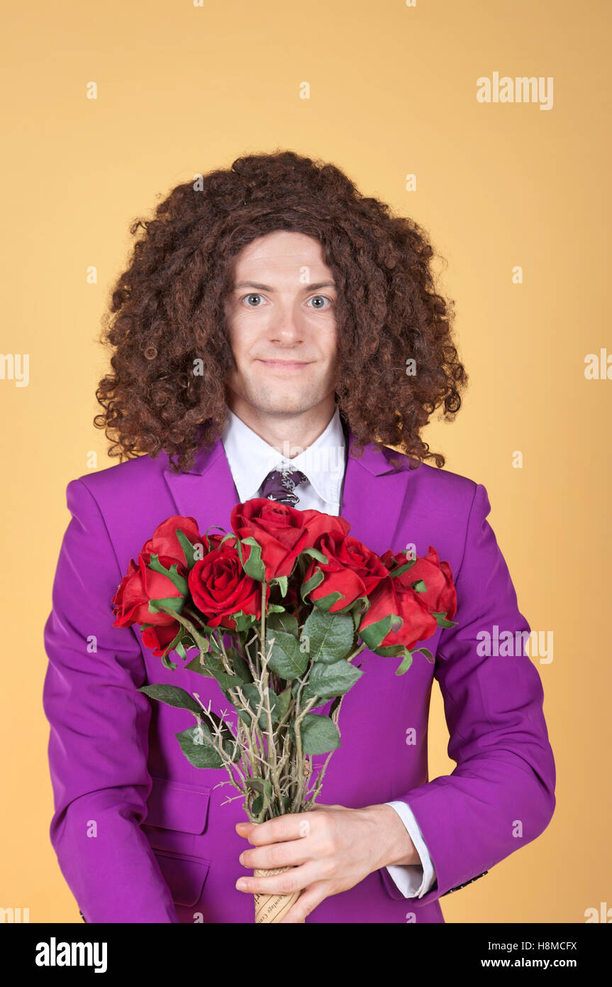 Caucasian man with afro wearing Purple Suit Stock Photo
